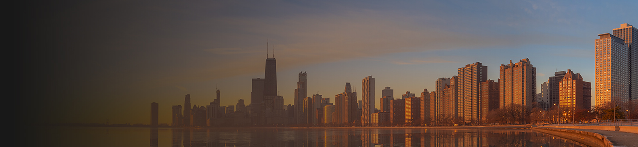 A stunning view of the Chicago skyline at sunset, with colorful clouds in the sky and buildings illuminated by the fading light.